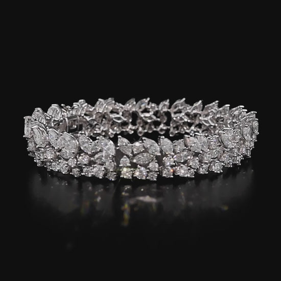 18 ayar beyaz altın üzerine 6,14 karat yuvarlak ve 8,05 karat markiz kesim pırlanta işlenmiş zarif tasarım bilezik, özel günler için ideal.